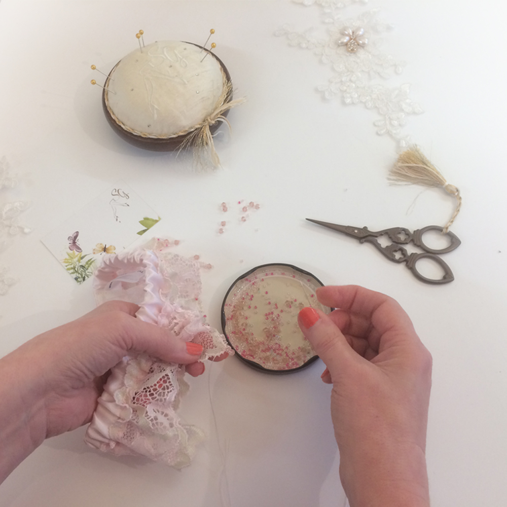 hand sewing the pink dream wedding garter